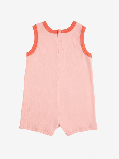 Smiling pink playsuit